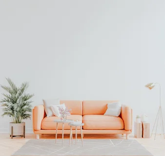 Living room interior wall mockup in warm tones with leather sofa on white wall background.3d rendering
